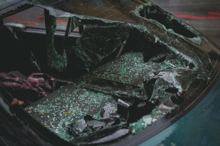 Shattered windshield and scattered glass inside a car after a serious accident in Ontario.